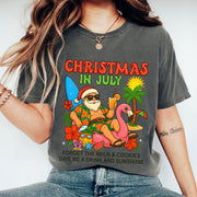 Christmas in July Festive T-Shirt - Fun Santa Summer Vibes with Flamingo and Tropical Design, Cool Holiday Graphic Tee for Beach Parties
 - 1