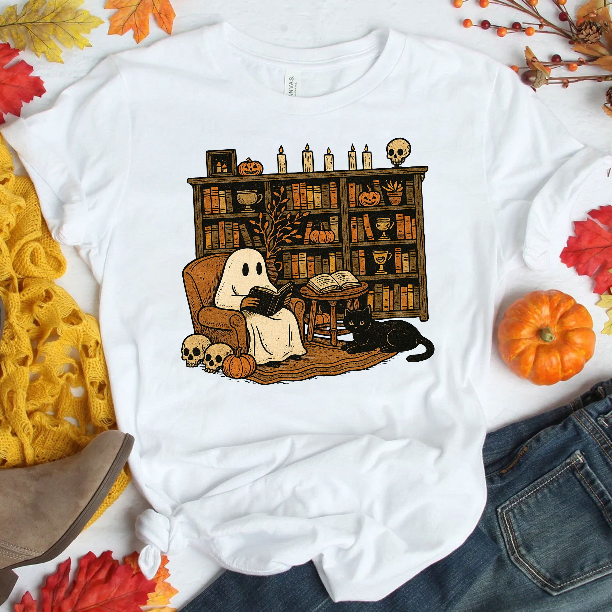 Cozy Halloween Ghost T-Shirt with Bookshelf, Cat, and Pumpkin – Perfect Spooky Fall Outfit for Book Lovers and Autumn Enthusiasts
 - 1