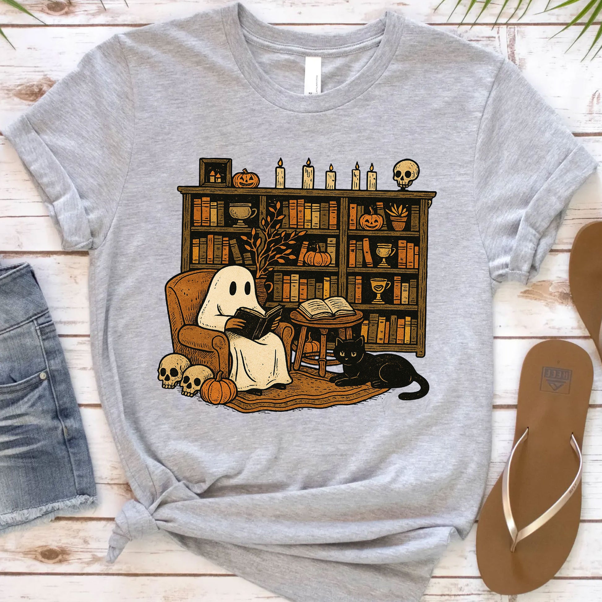 Cozy Halloween Ghost T-Shirt with Bookshelf, Cat, and Pumpkin – Perfect Spooky Fall Outfit for Book Lovers and Autumn Enthusiasts
 - 12