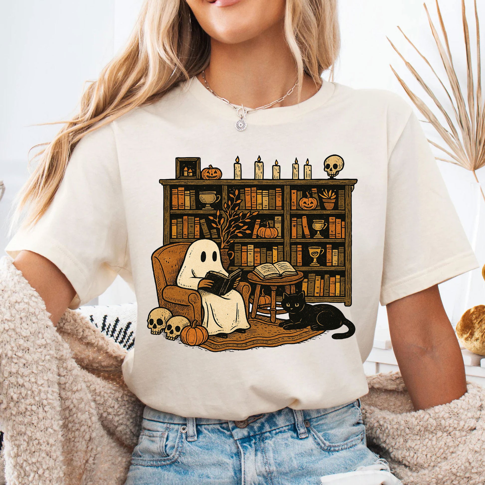 Cozy Halloween Ghost T-Shirt with Bookshelf, Cat, and Pumpkin – Perfect Spooky Fall Outfit for Book Lovers and Autumn Enthusiasts
 - 4
