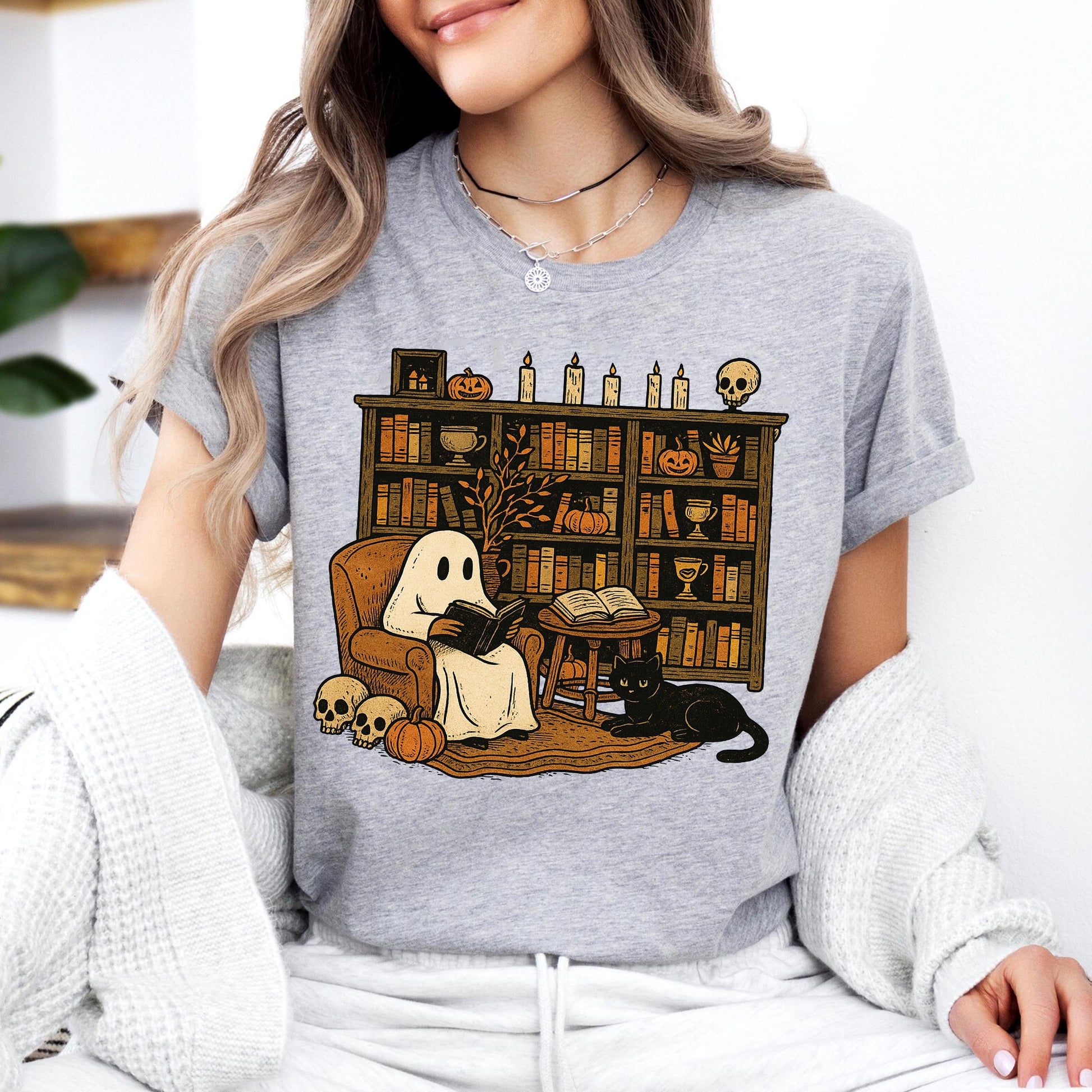 Cozy Halloween Ghost T-Shirt with Bookshelf, Cat, and Pumpkin – Perfect Spooky Fall Outfit for Book Lovers and Autumn Enthusiasts
 - 7