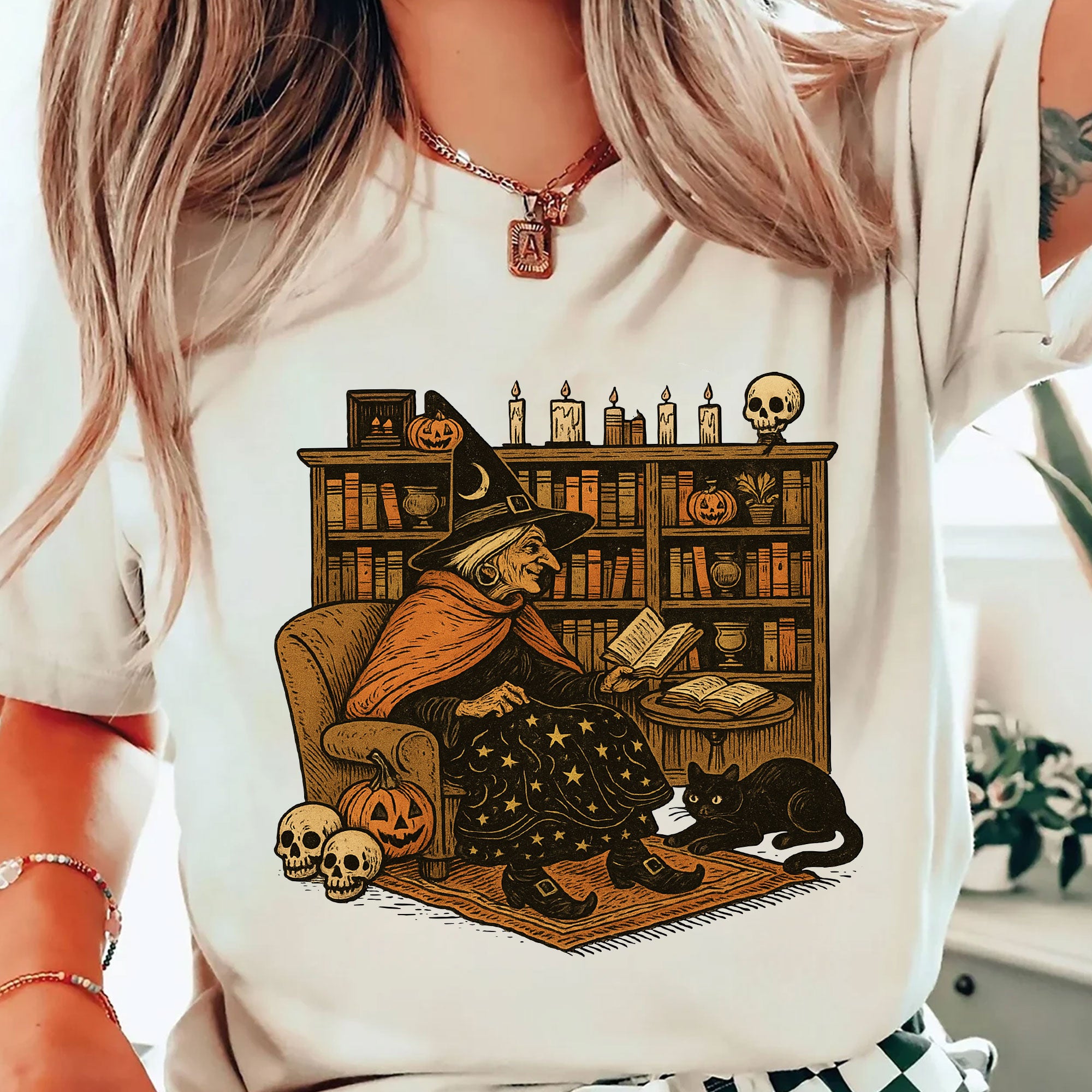 Cozy Halloween Witch Reading T-Shirt with Black Cat and Pumpkin Design – Perfect Spooky Season Gifts for Book Lovers and Cat Enthusiasts
 - 2