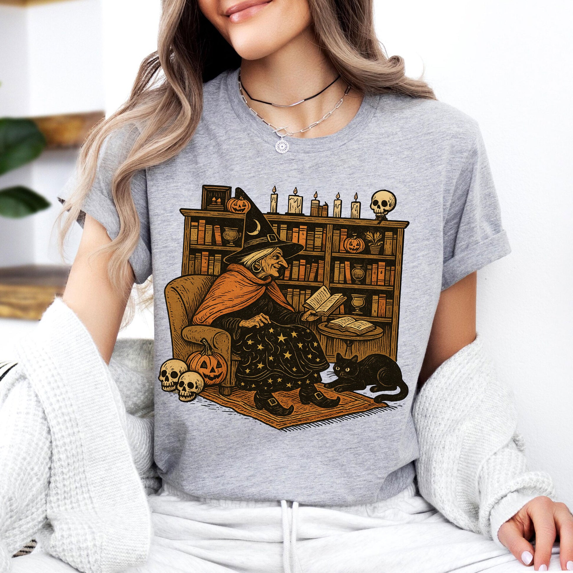 Cozy Halloween Witch Reading T-Shirt with Black Cat and Pumpkin Design – Perfect Spooky Season Gifts for Book Lovers and Cat Enthusiasts
 - 7