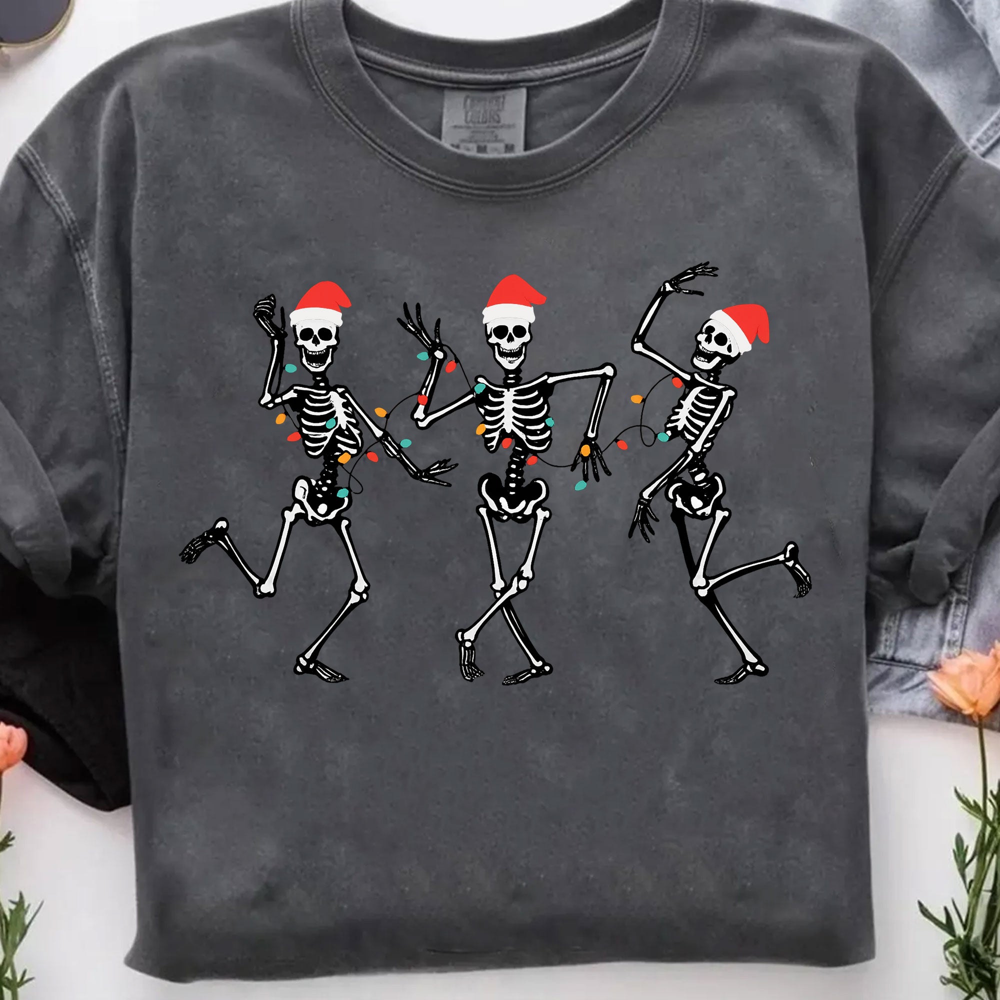Dancing Skeletons Christmas T-Shirt – Festive Santa Skeletons Graphic Tee – Fun Holiday Apparel for Celebrating Christmas Season
 - 7
