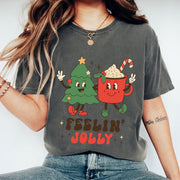 Festive Christmas Graphic Tee - Cute Tree and Mug Cartoon Design - Feelin' Jolly Holiday Shirt for Women - Fun Holiday Apparel
 - 1
