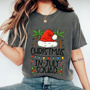 Festive 'Christmas in July Squad' T-Shirt with Santa Hat and Palm Trees - Perfect Holiday Celebration Tee for Summer Fun
 - 1