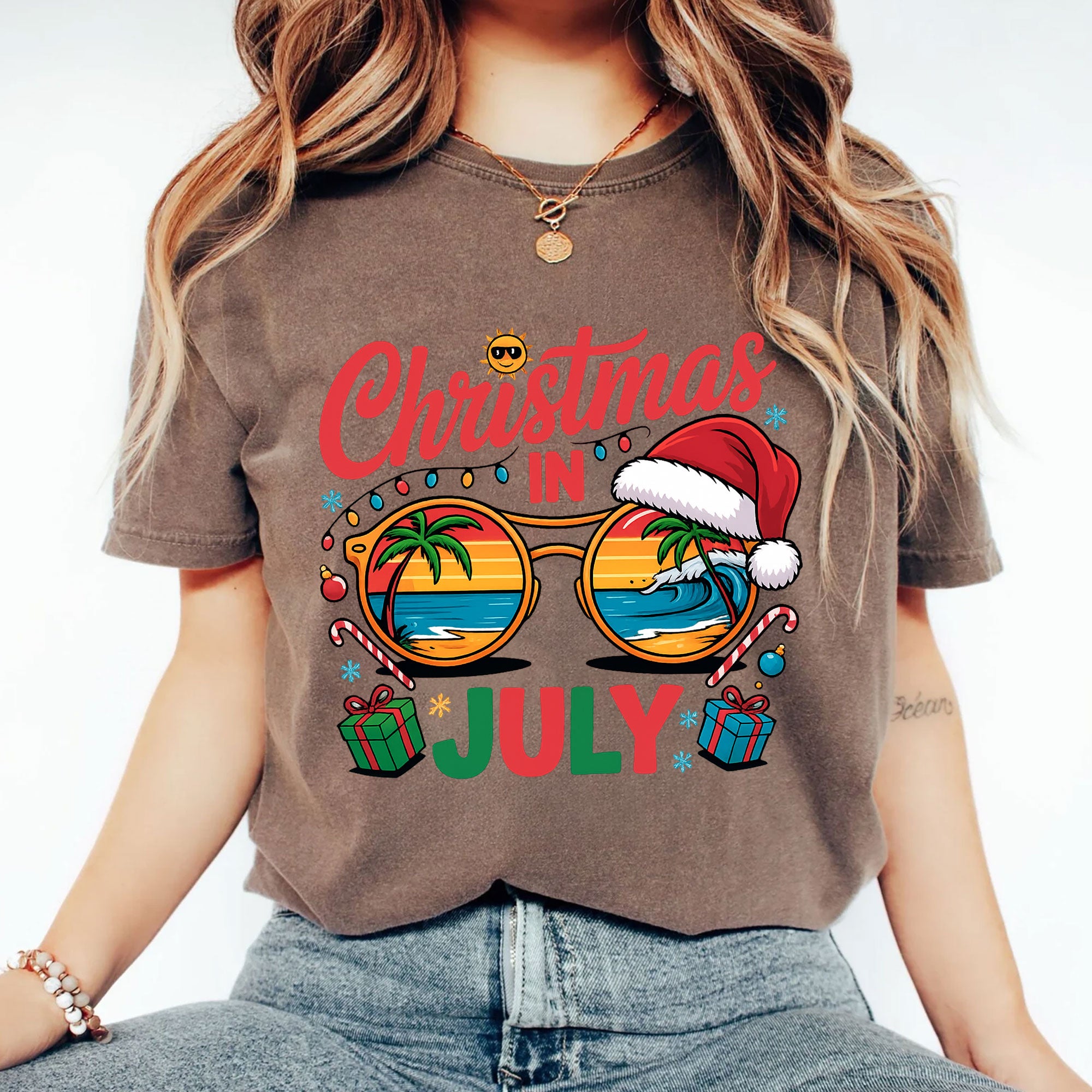 Festive Christmas in July Women's T-Shirt: Fun Holiday Graphic Tee Featuring Beach Scene, Sunglasses, and Santa Hat Design
 - 2