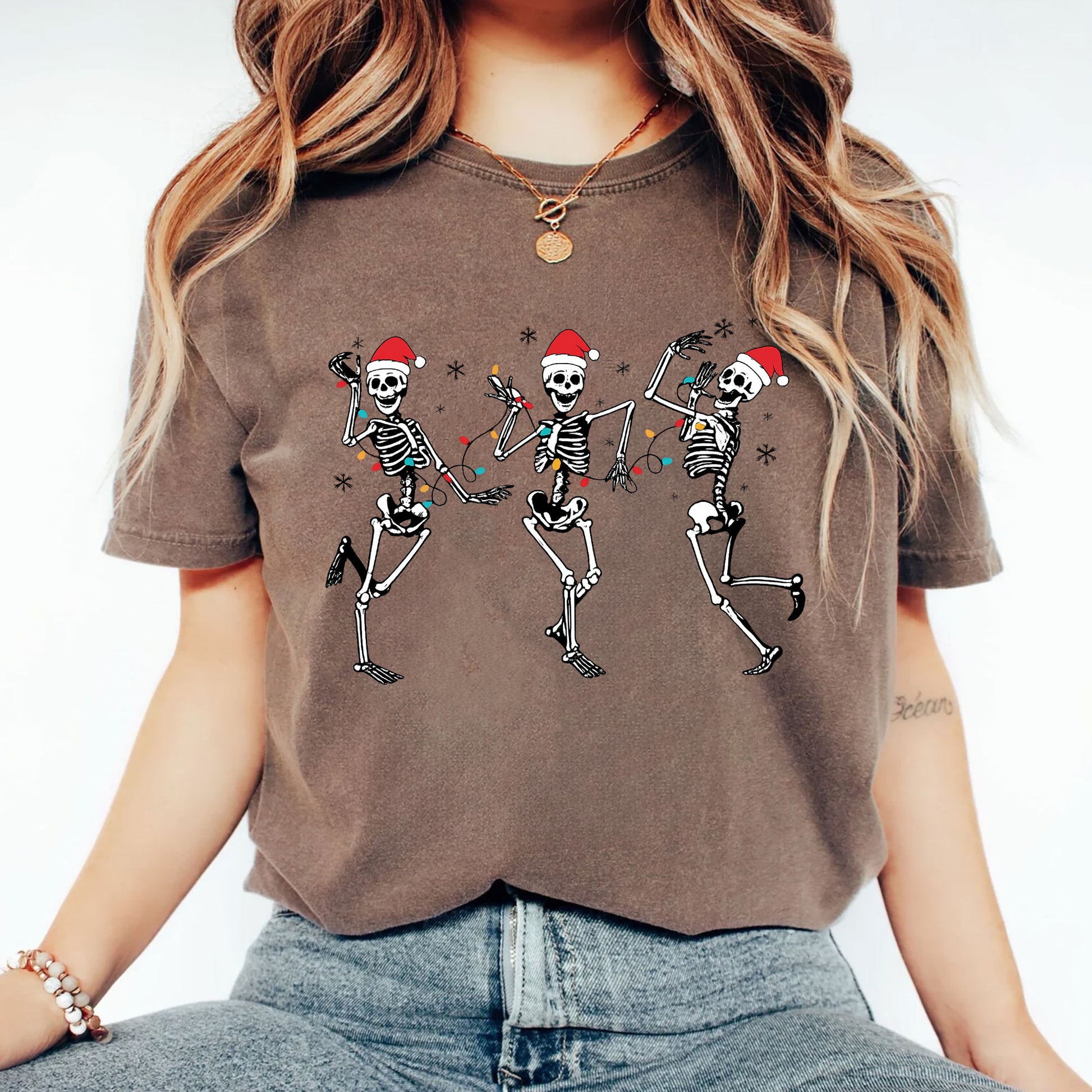 Festive Dancing Skeletons Christmas T-Shirt – Funny Holiday Skeleton Graphic Tee with Santa Hats for Women – Unique Christmas Apparel
 - 2