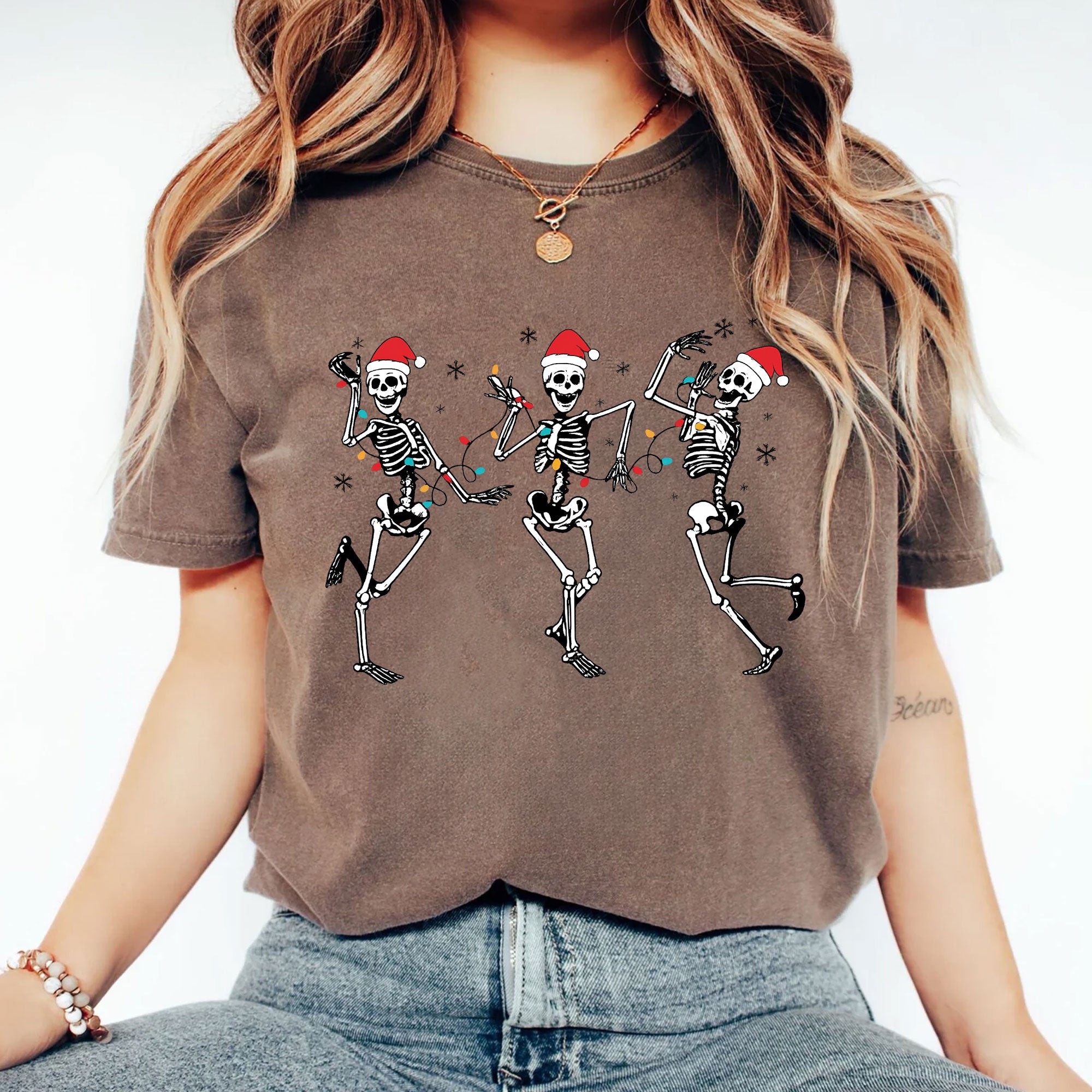 Festive Dancing Skeletons Christmas T-Shirt – Funny Holiday Skeleton Graphic Tee with Santa Hats for Women – Unique Christmas Apparel
 - 2