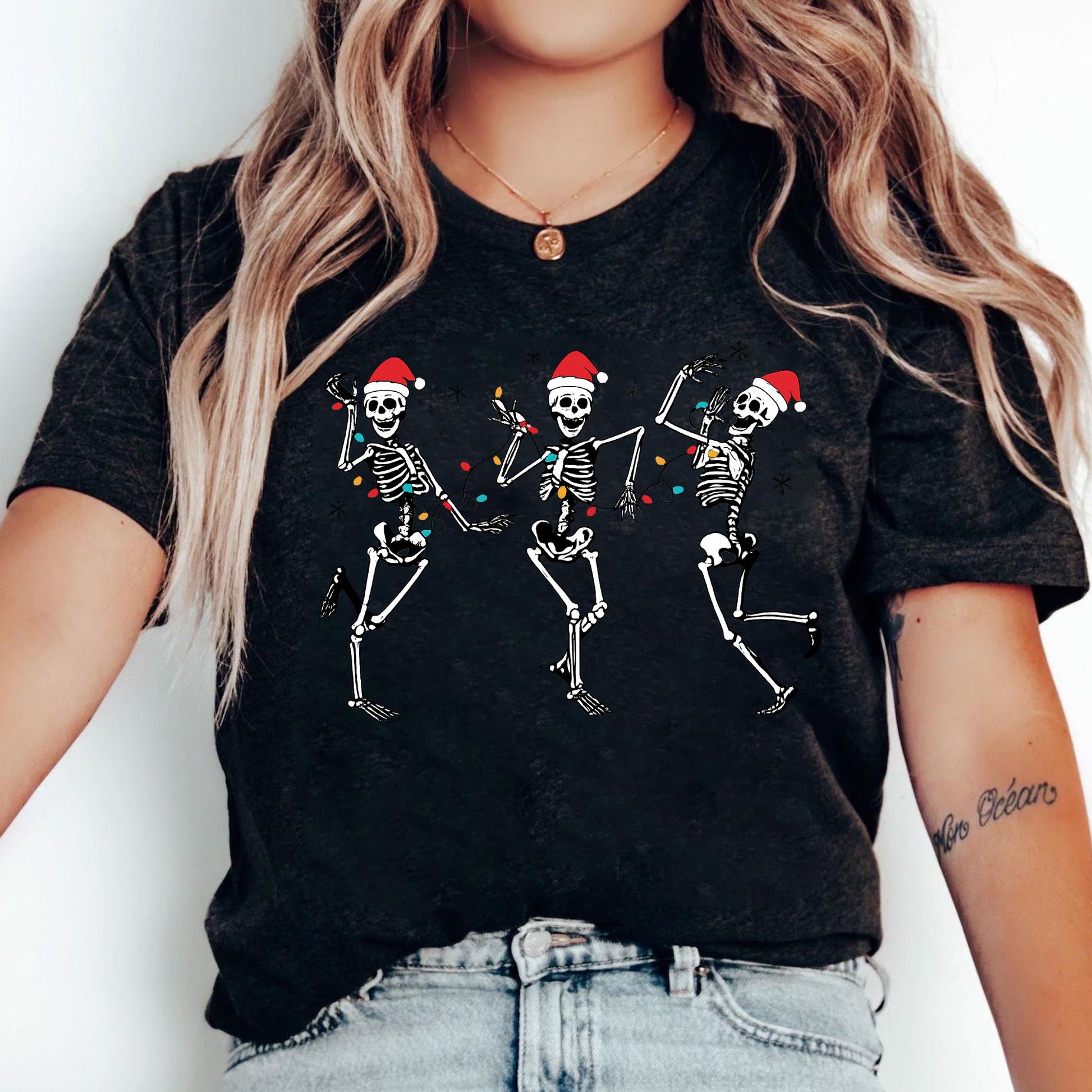 Festive Dancing Skeletons Christmas T-Shirt – Funny Holiday Skeleton Graphic Tee with Santa Hats for Women – Unique Christmas Apparel
 - 5