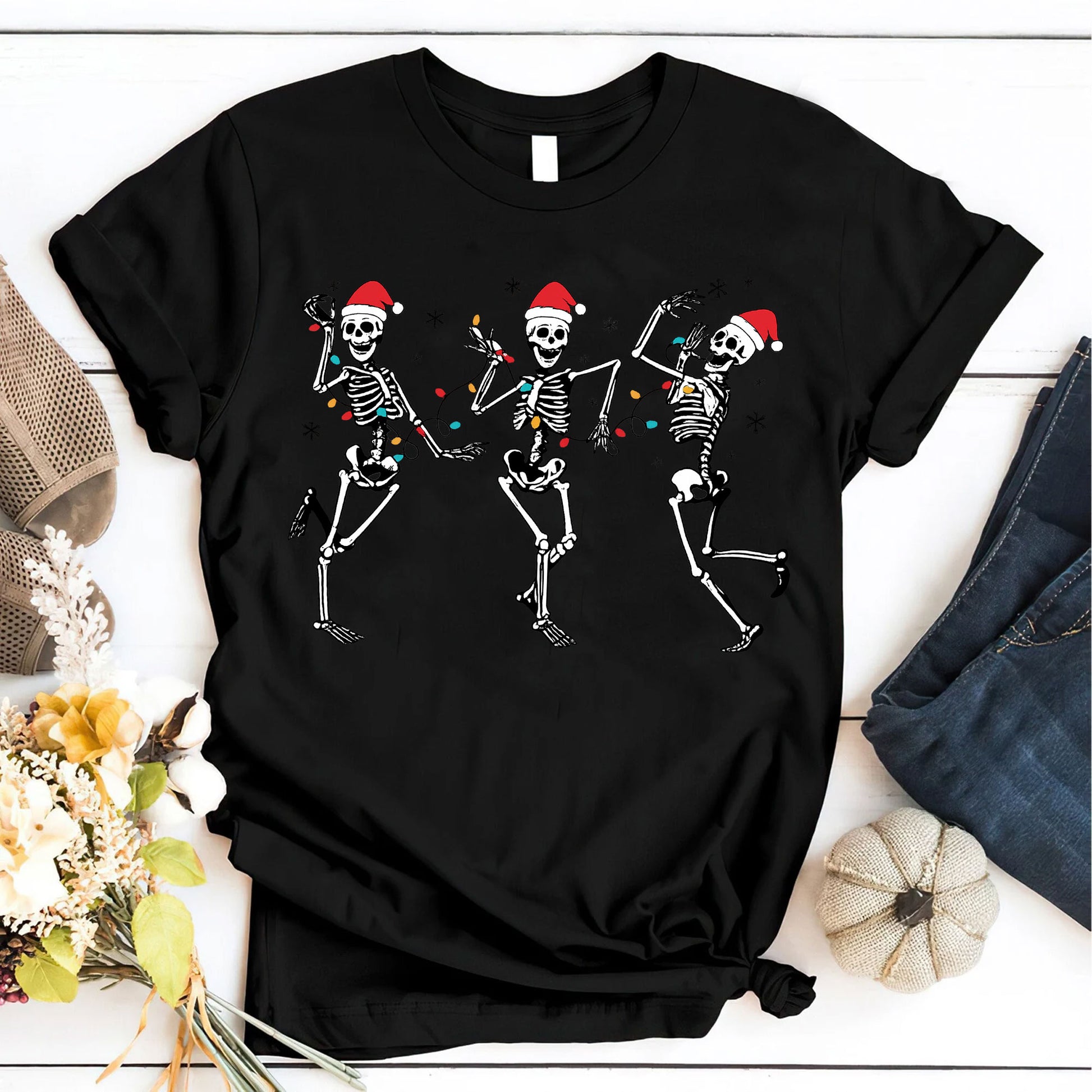 Festive Dancing Skeletons Christmas T-Shirt – Funny Holiday Skeleton Graphic Tee with Santa Hats for Women – Unique Christmas Apparel
 - 6