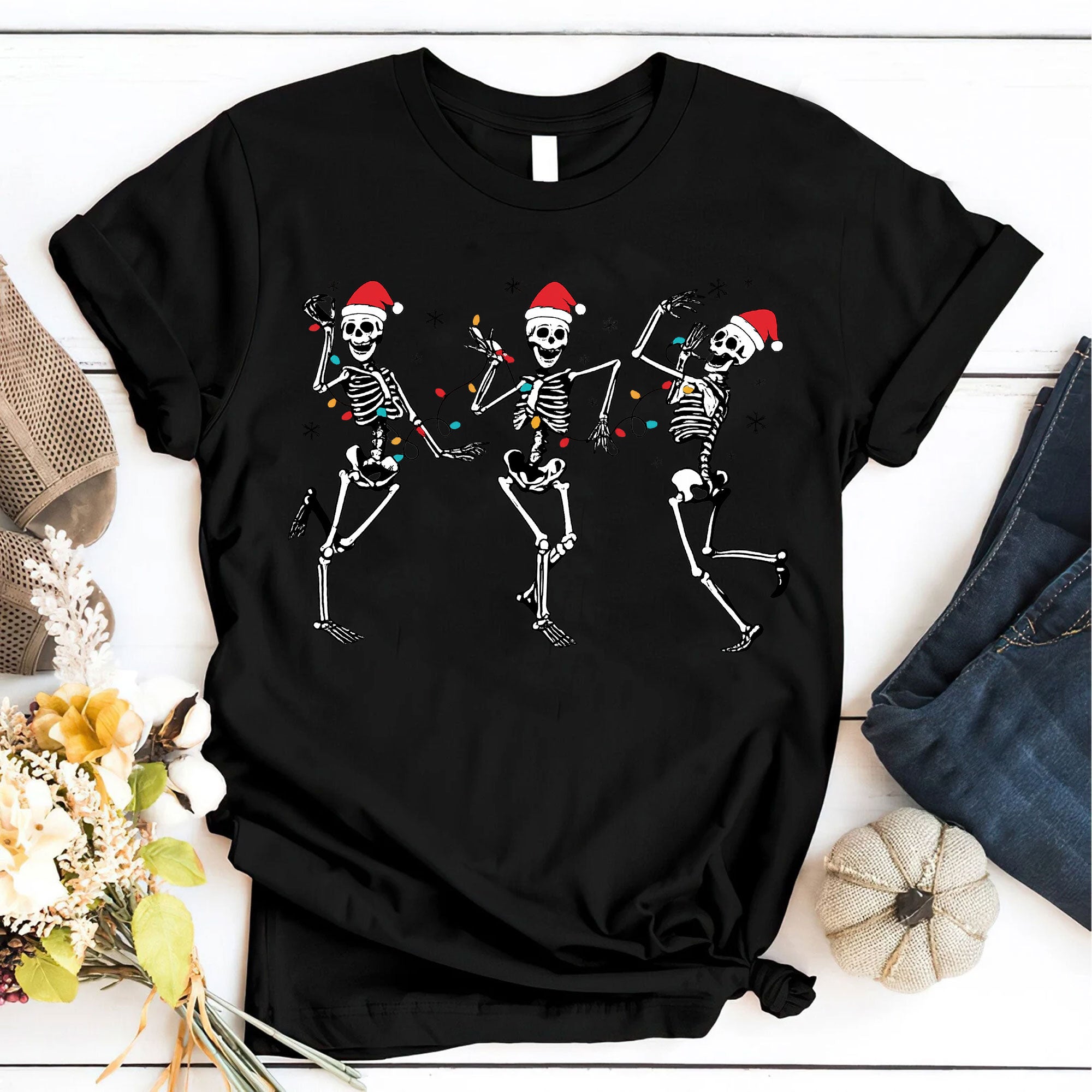 Festive Dancing Skeletons Christmas T-Shirt – Funny Holiday Skeleton Graphic Tee with Santa Hats for Women – Unique Christmas Apparel
 - 6