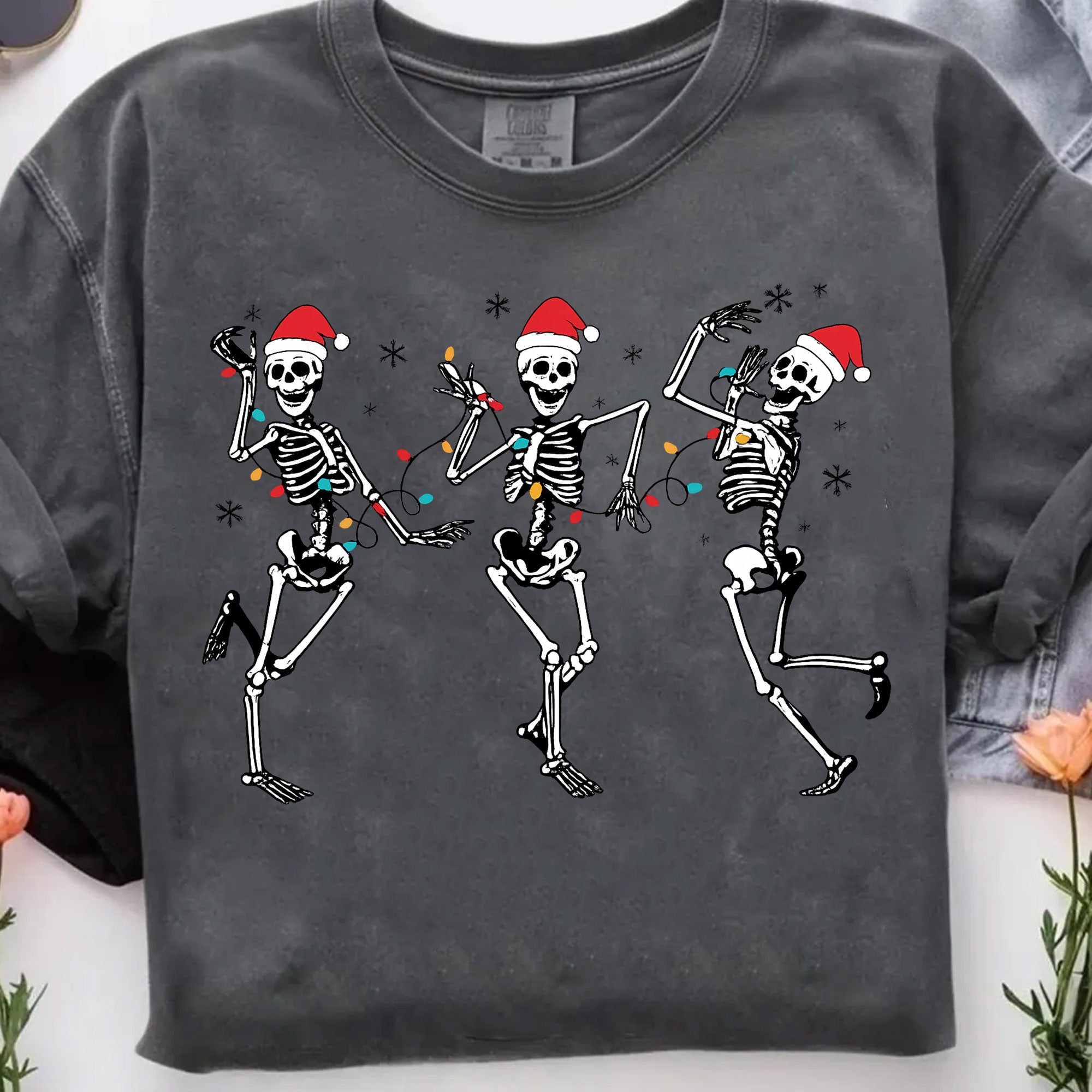 Festive Dancing Skeletons Christmas T-Shirt – Funny Holiday Skeleton Graphic Tee with Santa Hats for Women – Unique Christmas Apparel
 - 7