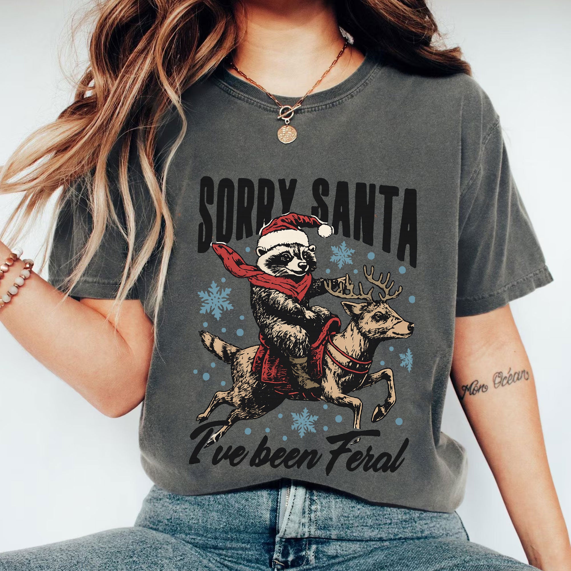 Funny Christmas Graphic Tee - Sorry Santa Raccoon on Reindeer - Humorous Holiday T-Shirt - Perfect Feral Santa Gift Idea
 - 1