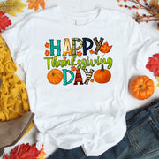 Happy Thanksgiving Shirt with Colorful Leaves and Pumpkins – Perfect for Fall Celebrations and Family Gatherings – Women's Casual Tee
 - 1