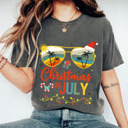 Trendy Christmas in July T-Shirt with Tropical Sunglasses Design | Fun Holiday Graphic Tee for Summer Celebrations and Gifting
 - 1