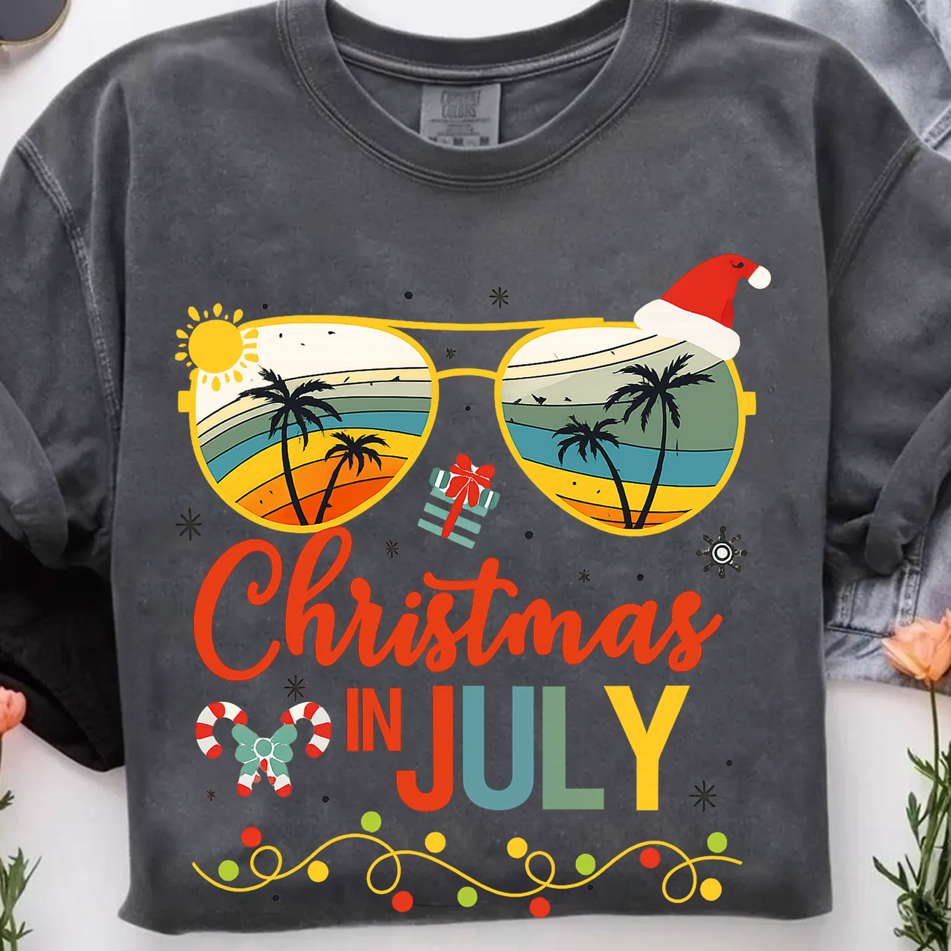 Trendy Christmas in July T-Shirt with Tropical Sunglasses Design | Fun Holiday Graphic Tee for Summer Celebrations and Gifting
 - 7