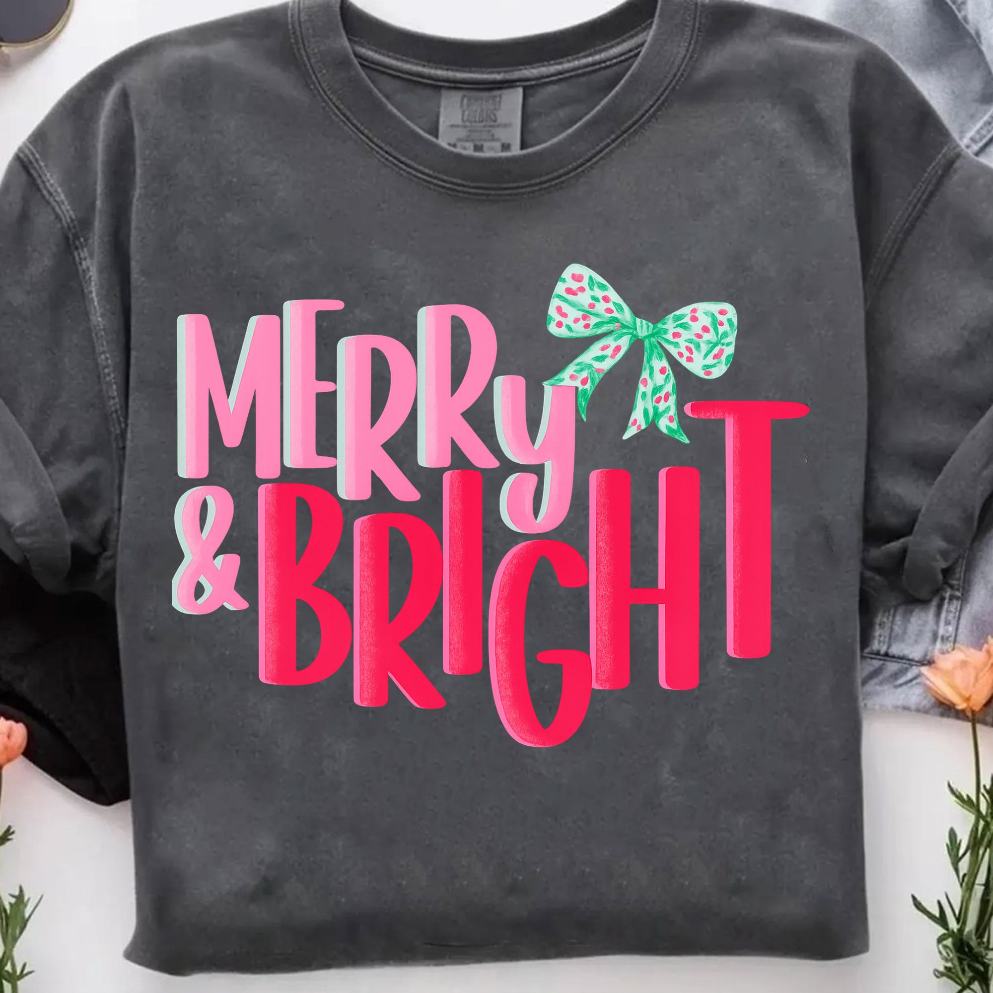 Trendy Merry & Bright Christmas Graphic Tee for Women – Festive Holiday T-Shirt with Colorful Bow Design | Perfect Gift Idea
 - 7